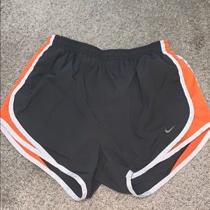 Dark gray and orange Nike shorts